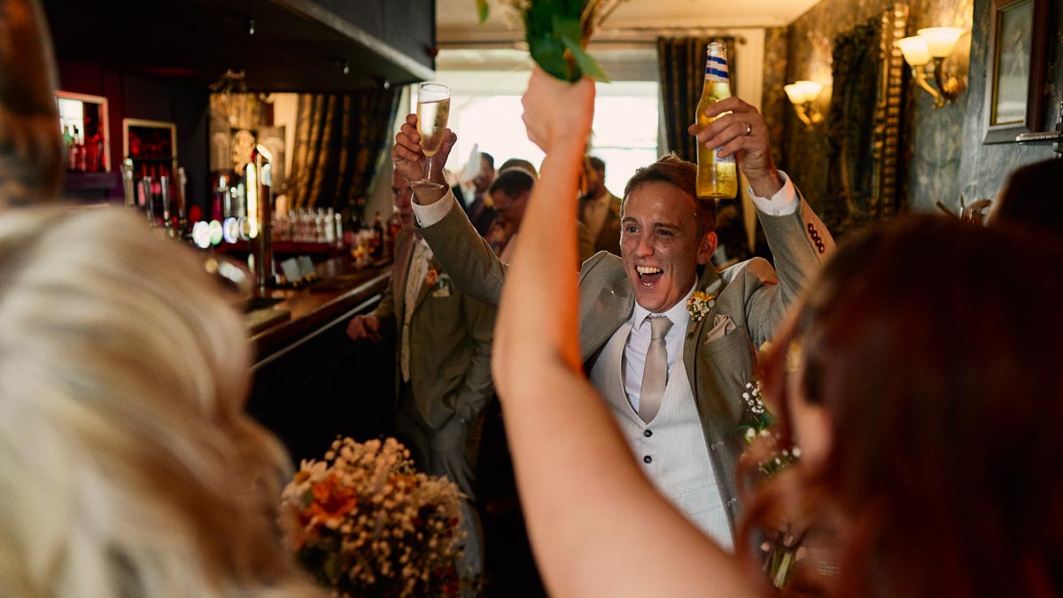 groom celebrating after their wedding ceremony